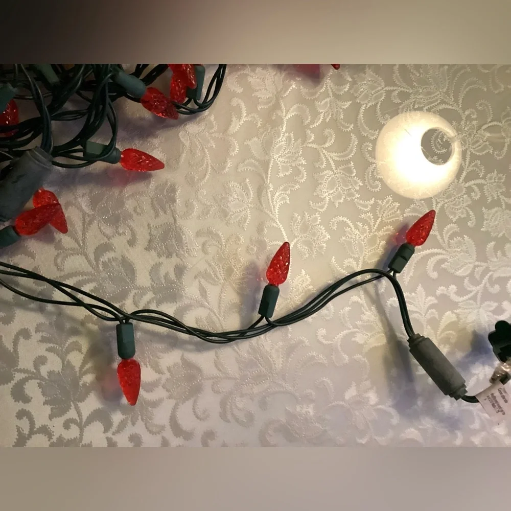 2 Christmas strings red light, bulbs faceted cone shape.